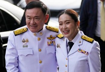 Thaksin & Paetongtarn in official uniforms